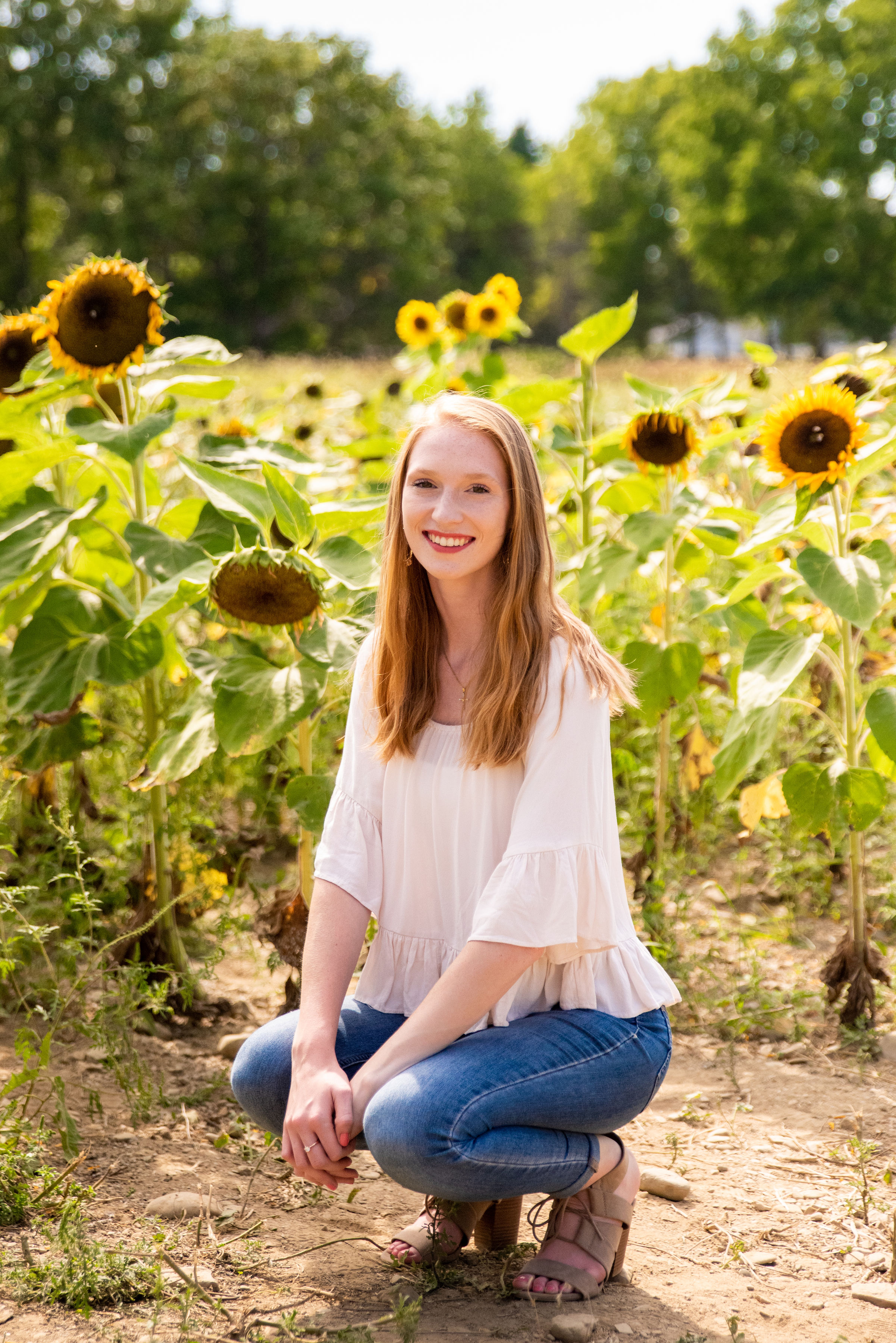 Portrait photo of Bianka Alexander in Sunflower field